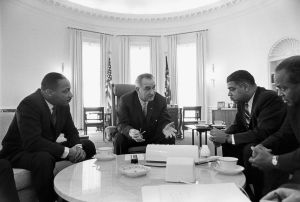 President Lyndon B. Johnson meets with Civil Rights leaders Martin Luther King, Jr., Whitney Young, and James Farmer, January 1964. 